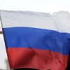 Президент наградил офицеров спецназа за отражение атаки сотен боевиков в Сирии (Флаг РФ в Сирии. Архивное фото) Флаг РФ в Сирии. Архивное фото
