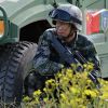 Почему Пекину понравился саммит НАТО (Военнослужащий КНР участвует в учениях вооруженных сил стран-членов ШОС Мирная миссия-2018 | © РИА Н…) Военнослужащий КНР у…