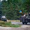 Боевики батальона 'Айдар', включая командный состав, добровольно сдались (На фото: бойцы украинского националистического батальона на бронетранспортерах (Фото: Sergii Kharche…) На фото: бойцы украи…