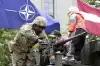 Военные Латвии повышают доходы гробовщиков